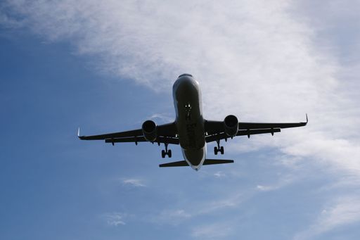 plane from eurowings on approach to the cologne bonn airport, blue cloudy sky