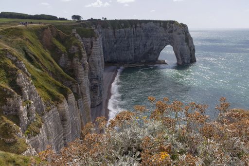 An aerial view of beautiful mountains near the water in Etretat, France