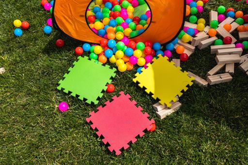 A closeup of puzzle foams with colorful balls in the outdoor playground