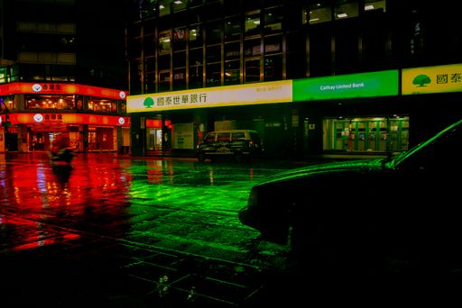 A beautiful shot of neon-soaked streets in Taipei, Taiwan while raining at night