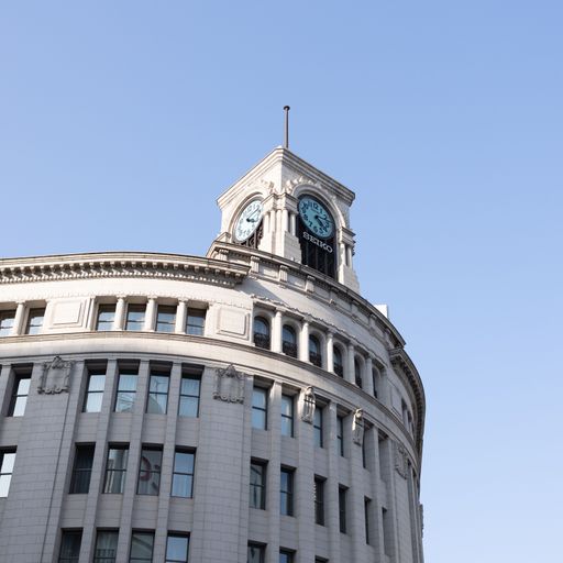 A low angle shot of the Hattori Clock Tower in Tokyo, Japan