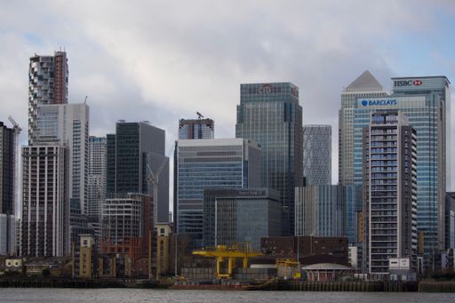 A beautiful view of the urban MUFG EMEA buildings Financial institution in London, England, UK with a gray sky