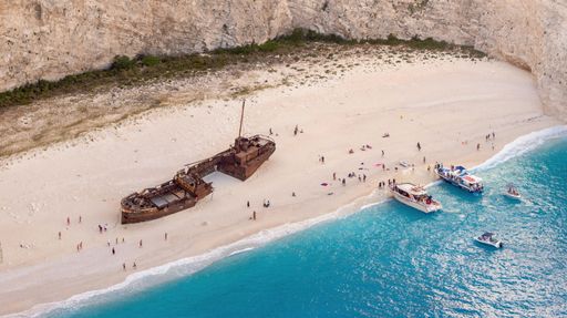 An aerial view of old boat ruins on a Navagio beach in Zakynthos.