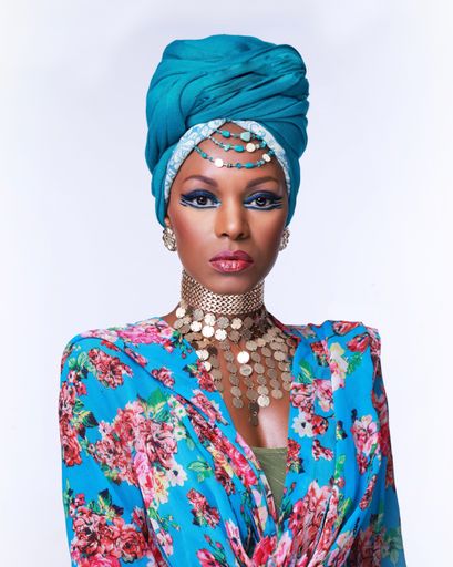 A portrait of a beautiful African-American female with a headwrap isolated on white background