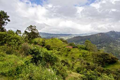 A scenery of rural hills on a cloudy day