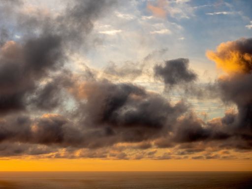 View of sunset clouds over Tasman sea, Pacific ocean