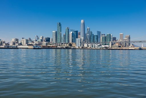 A beautiful view of sea with City of San Francisco skyline under clear sky