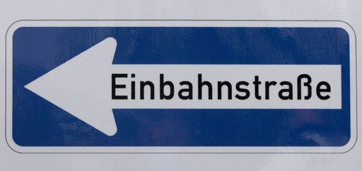 A closeup of "One-way street" sign next to the wedding room in Essen-Heisingen town hall
