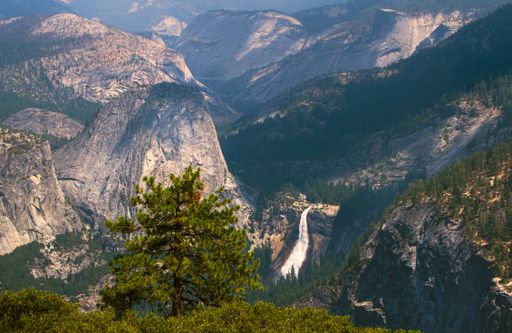 A high angle shot of forested mountains at daytime