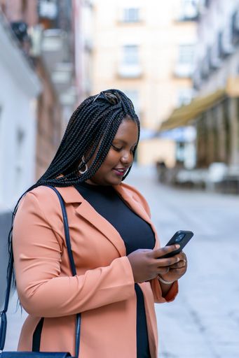 young african woman using her smartphone