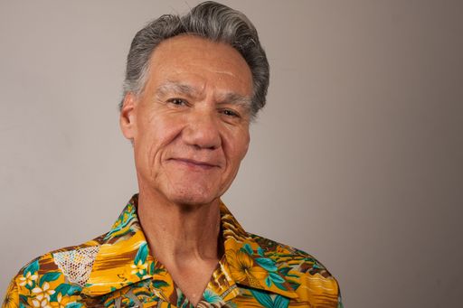 Heads shot Portrait  of a mature man 60 plus wearing a Hawaiian shirt