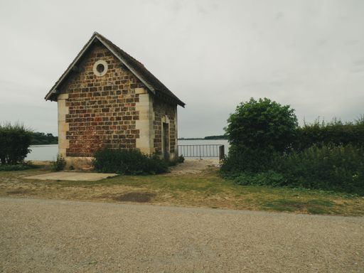An old brick fishing house near the lake