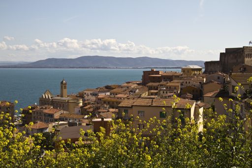 A beautiful shot of Porto Santo Stefano village with blue sky in the background