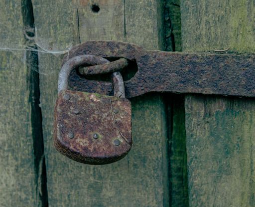 A closeup shot of an old rusty padlock