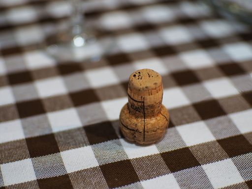 A closeup shot of wine cork on a tablecloth