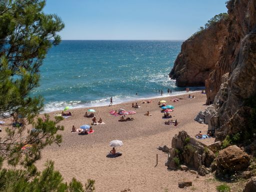 A beautiful view of people relaxing on a sandy beach