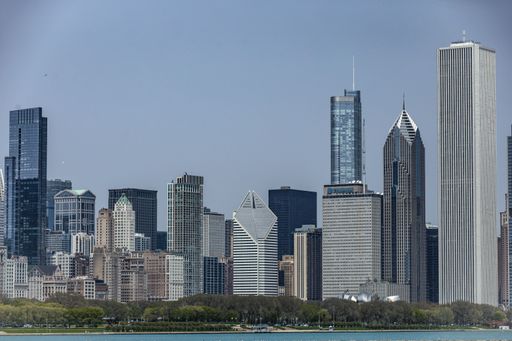 A beautiful shot of Aon Center near skyscrapers of Chicago, Illinois
