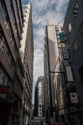 A low angle shot of skyscrapers and streets of Tokyo in Japan