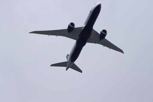 The view of the flying plane against the grayish-blue sky. Mississauga, Canada.