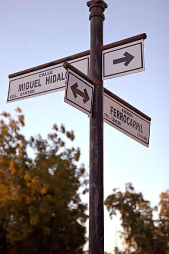 A Street Sign in Guamuchil Sinaloa, Mexico against a cloudless sky