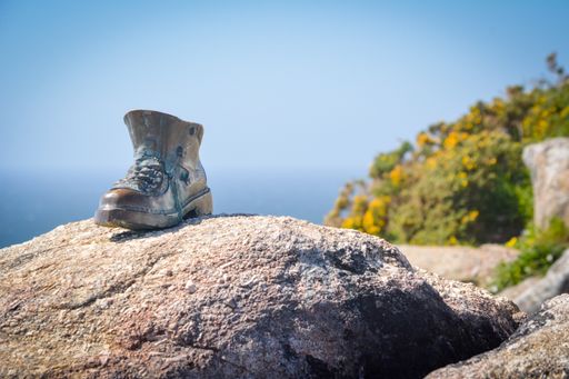 Cape Finisterre, Galicia, Spain, May 2018: Metal boot at Finisterre lighthouse, Camino Santiago