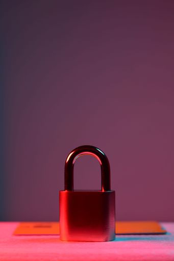 A vertical of a padlock with a credit card on a table. Concept of  e-commerce cybersecurity