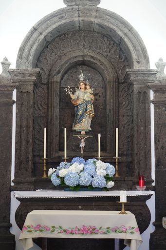 Shrine with Mother Mary and Jesus at the white chapel Ermida de Nossa Senhora da Paz above Vila Franca do Campo, Sao Miguel, Azores, Portugal
