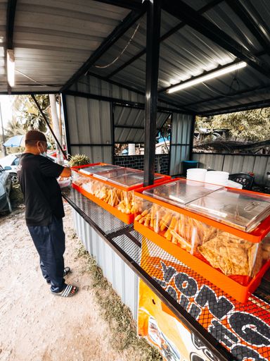 A customer standing in front of the Yong Tau Fu stall and waiting for the order