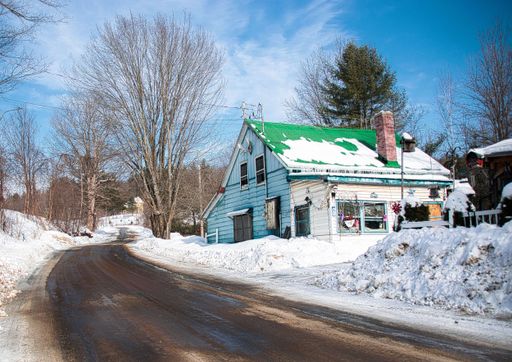 green house covered with snow during winter