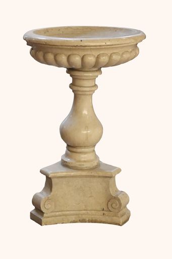 A marble holy water font for blessing and Christian religion