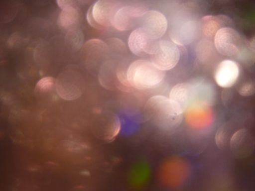 An abstract blurry background with round lens flare
