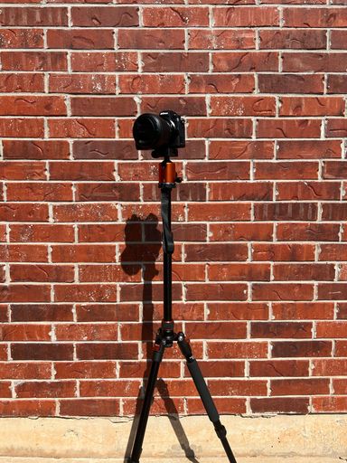 A vertical shot of a Nikon z6ii camera on a tripod
