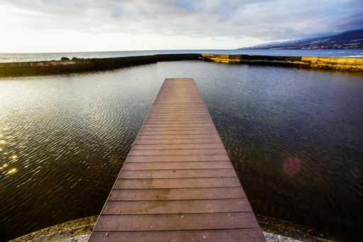Sunrise on a Pier over Atlantic Ocean in Tenerife Canary Islands Spain