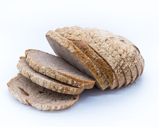 A closeup of a spelt sourdough bread isolated on a white background