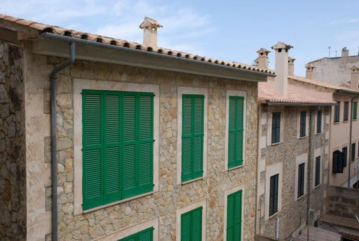 Green shutters on mediterranean stone house on Mallorca, Spain - Baleares