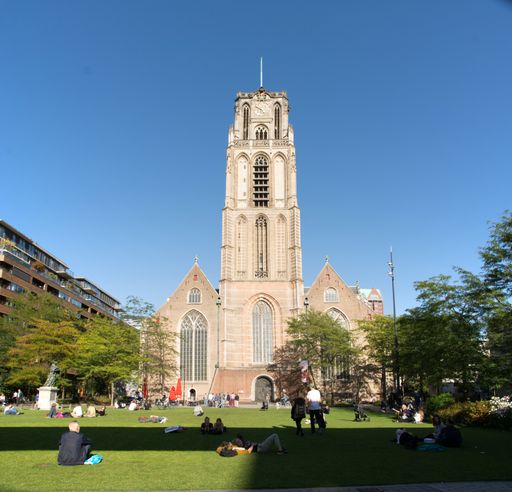 View on the Laurenskerk (Laurens Church) with people enjoying the sun on the Grotekerkplein. Netherlands traveland tourism.