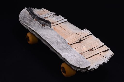 Vintage Style Concued Skateboard on a Black Background