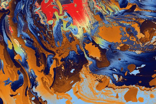 A closeup of a colorful marbling art pattern - great for abstract textile prints, background and wallpaper