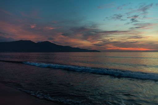 A breathtaking view of the beautiful sunset reflected in the sea with the colorful sky in the background
