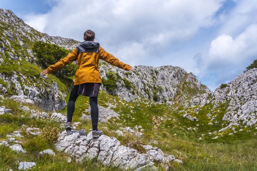 A woman standing on the mount Aitzkorri in Gipuzkoa