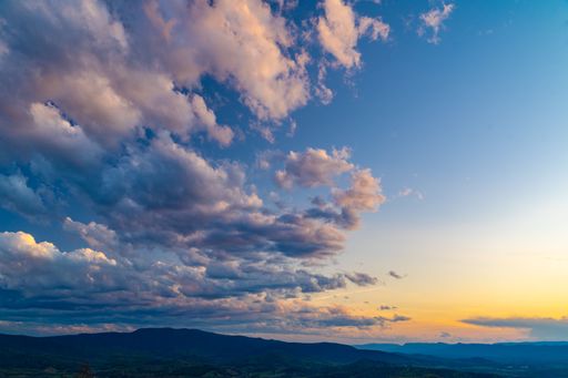 A scenic view of Shenandoah Valley, Virginia under beautiful cloudy sky at sunset