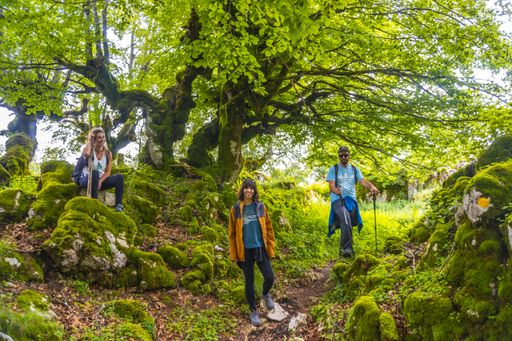 A group of friends climbing to the top of Mount Aizkorri ascent