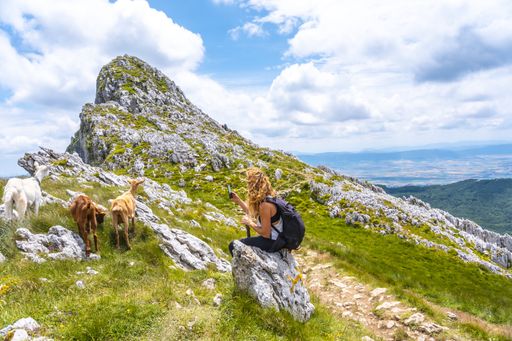 A group of friends climbing to the top of Mount Aizkorri ascent