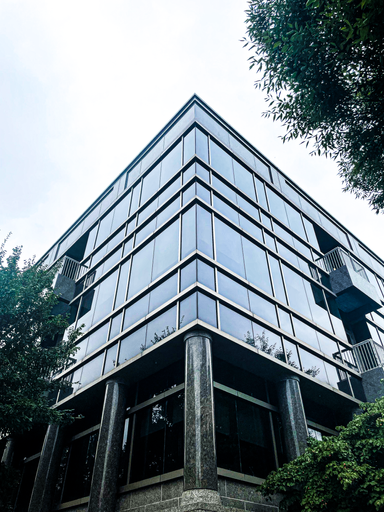 A photograph of a glass building