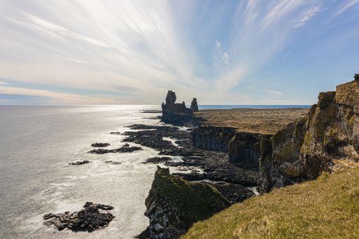 A long exposure shot of Arnarstapi cliff on the coastline of Snaefellsnes Peninsula in Iceland