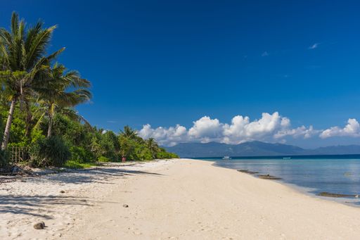 The beautiful view of the sandy shoreline and sea. Bon Bon Beach, Romblon, Philippines.