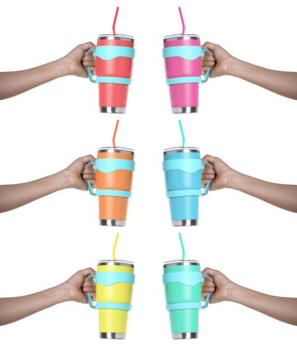 A vertical shot of hands holding colorful stainless steel thermos mug isolated on white background