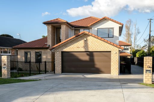 View of suburban house with garage.