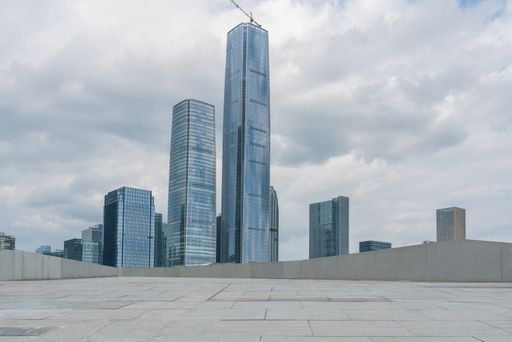 empty ground floor with modern cityscape and skyline in downtown during day time.