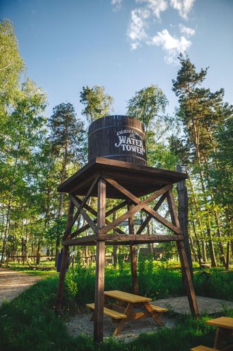 A vertical shot of an old western-style water reservoir